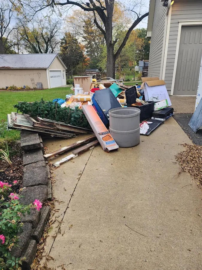 Dumpster being loaded with debris for Commercial Dumpster Rental in Fishhook
